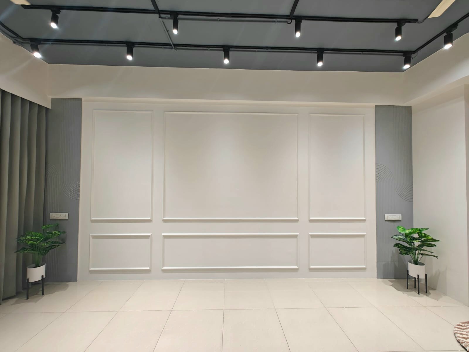 The white panelled backdrop wall used for shoots and portraits