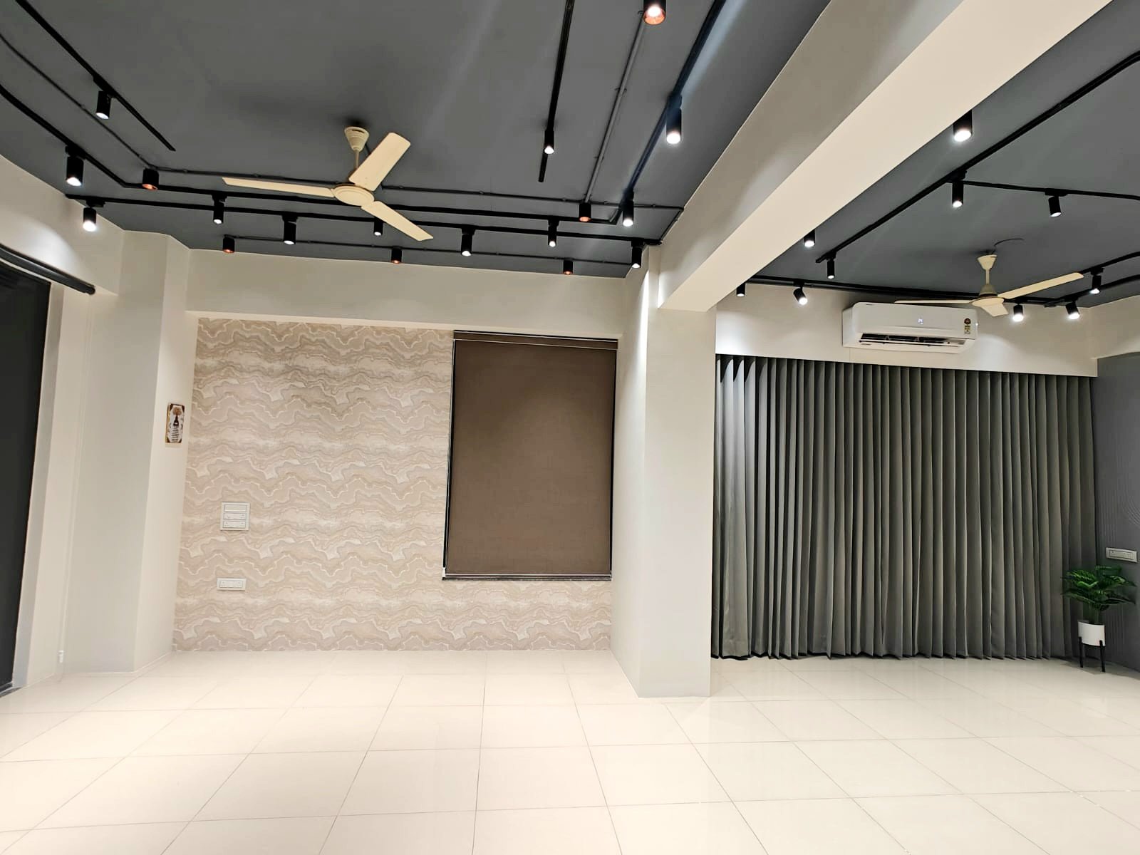 The far corner of the hall, showing both wall finishes